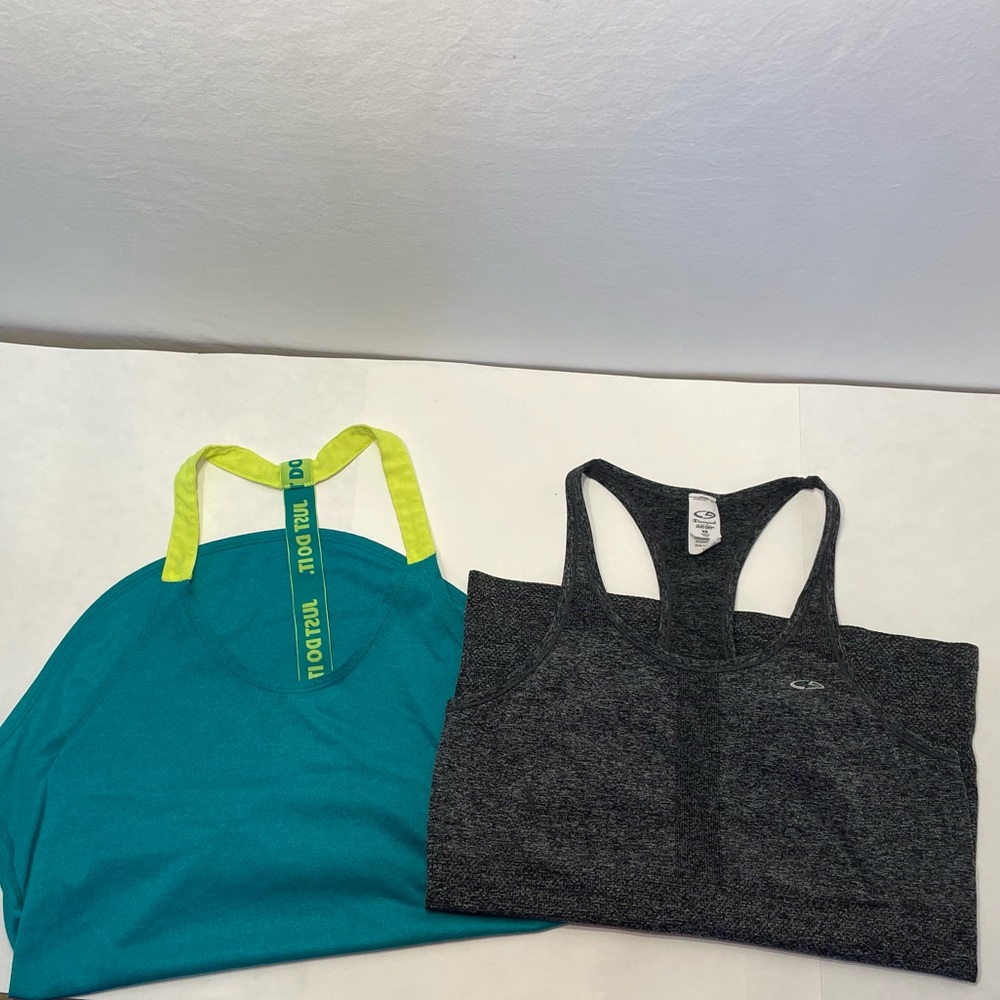 Bundle of XS Champion and S Nike tank tops.